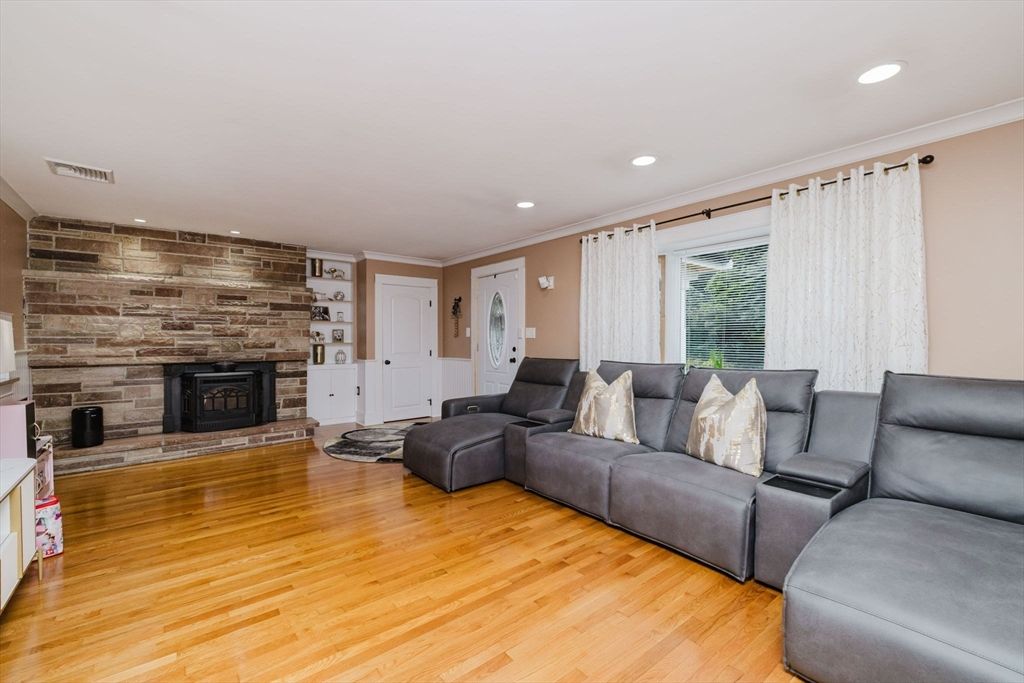 Fireplace, Interior, Living room, Recessed Lighting, Stone Walls, Wood Texture Flooring, Wooden Walls
