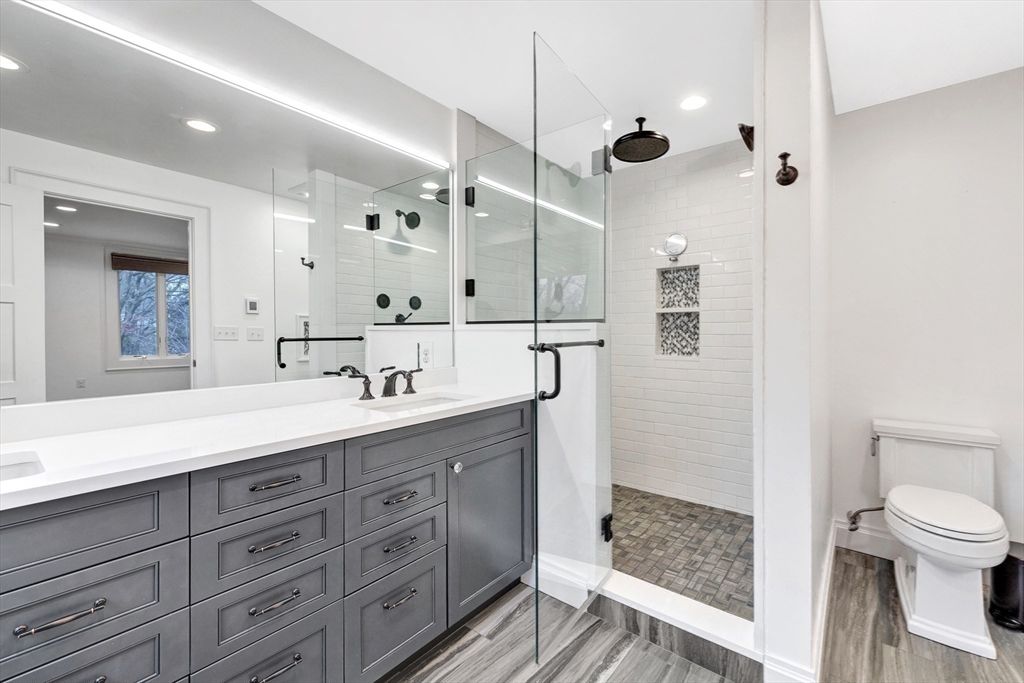 Bathroom, Dual Sink Vanities, Glass Shower, Interior, Recessed Lighting, Wood Texture Flooring