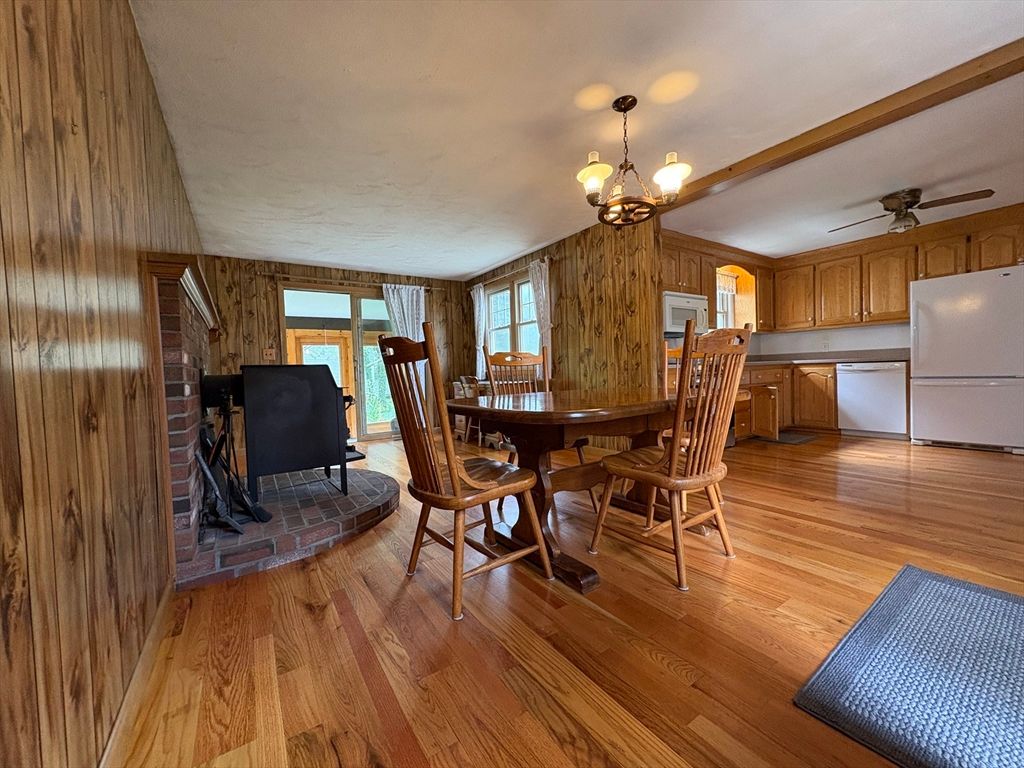Chandelier, Dining room, Fireplace, Interior, Kitchen, Wood Texture Flooring, Wooden Walls