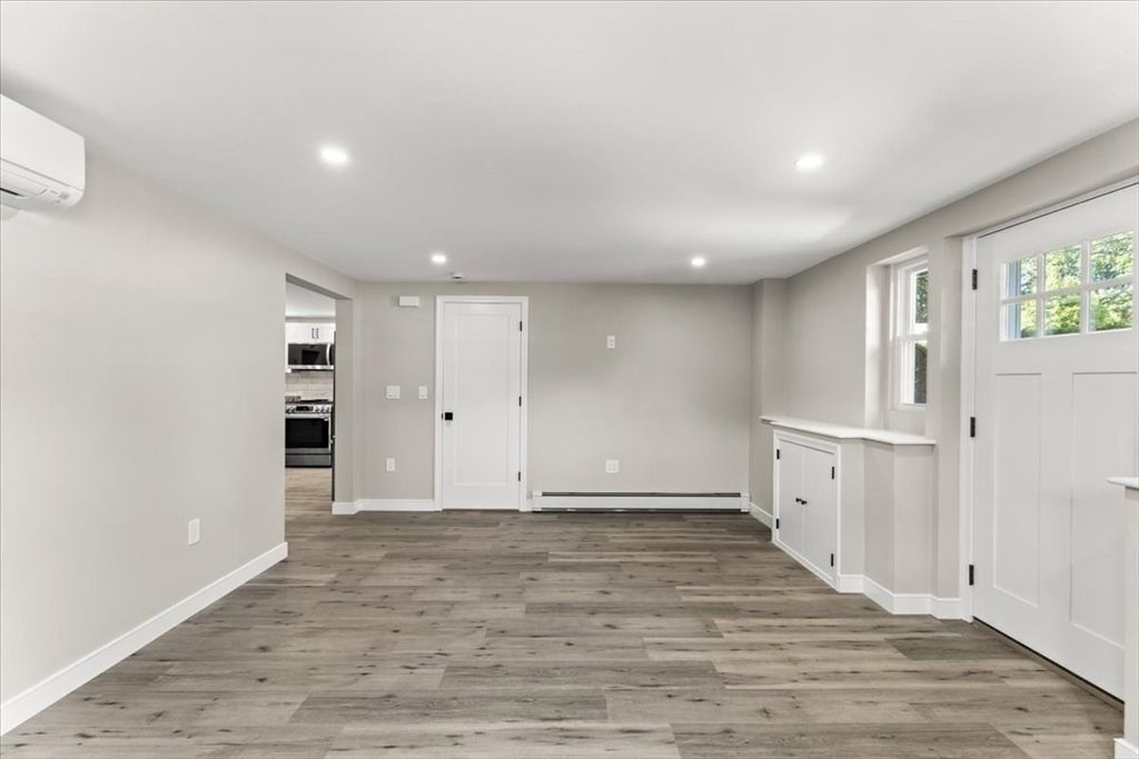 Empty room, Interior, Recessed Lighting, Stainless Steel Appliances, Wood Texture Flooring