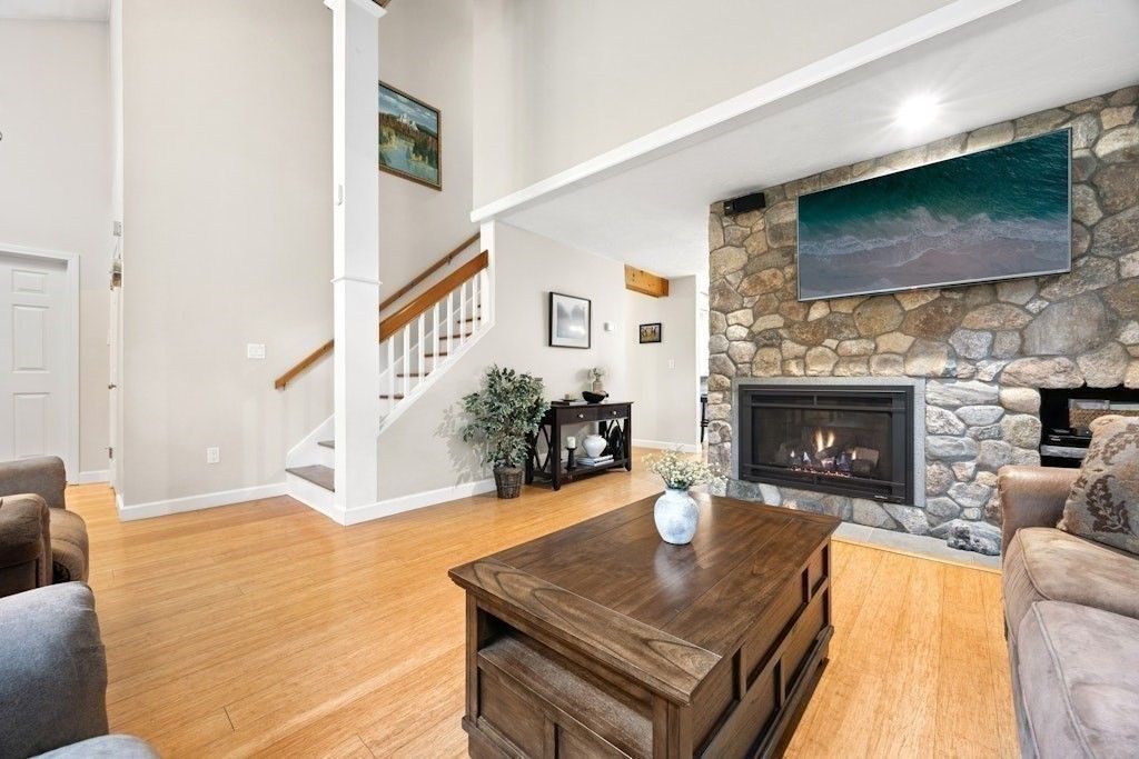 Fireplace, Interior, Living room, Recessed Lighting, Stone Walls, Wood Texture Flooring