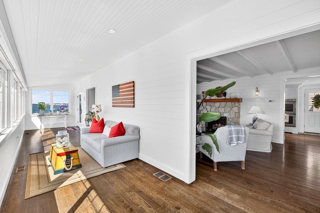 Fireplace, Interior, Living room, Recessed Lighting, Stainless Steel Appliances, Stone Walls, Wood Texture Flooring