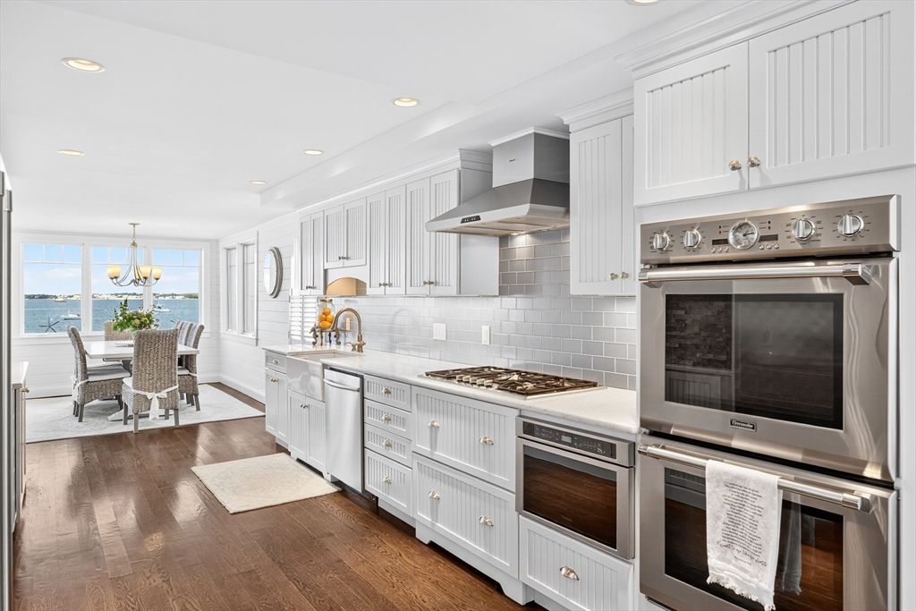 Chandelier, Dining room, Interior, Kitchen, Pendant Lights, Recessed Lighting, Stainless Steel Appliances, Water, Wood Texture Flooring