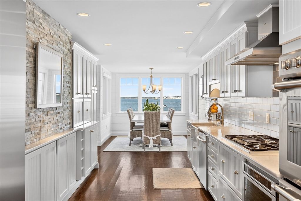 Chandelier, Dining room, Interior, Kitchen, Pendant Lights, Recessed Lighting, Stainless Steel Appliances, Stone Walls, Water, Wood Texture Flooring