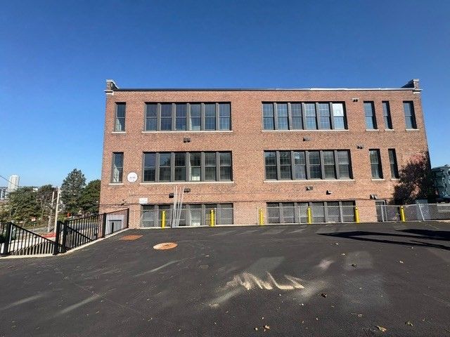 Exterior, Facade, Brick Facade, Condo Building