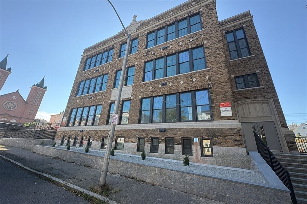 Exterior, Facade, Brick Facade, Condo Building