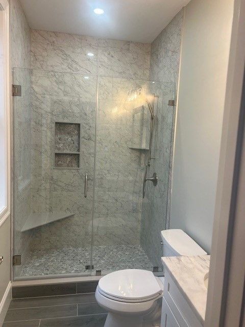 Bathroom, Glass Shower, Interior, Marble Walls, Recessed Lighting, Wood Texture Flooring
