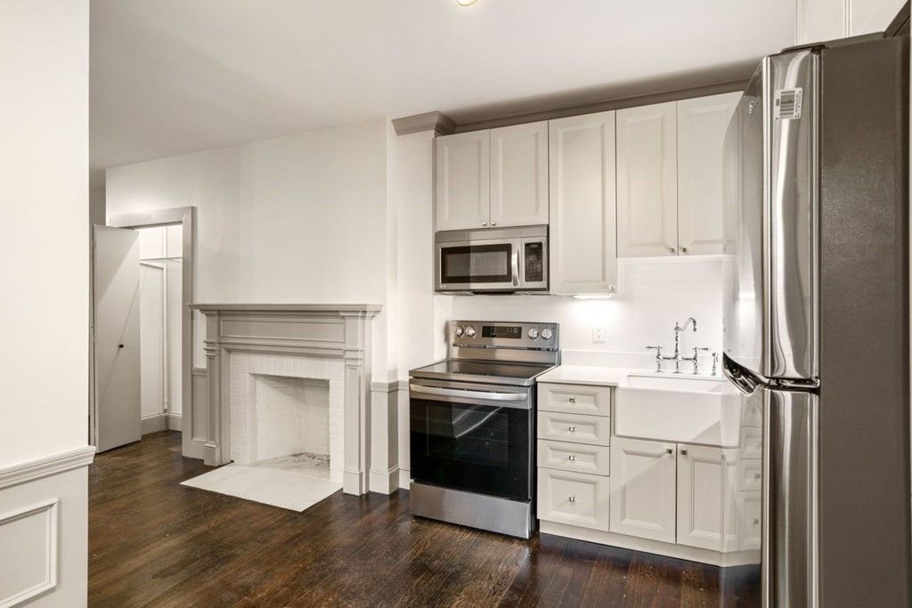 Fireplace, Interior, Kitchen, Recessed Lighting, Stainless Steel Appliances, Wood Texture Flooring