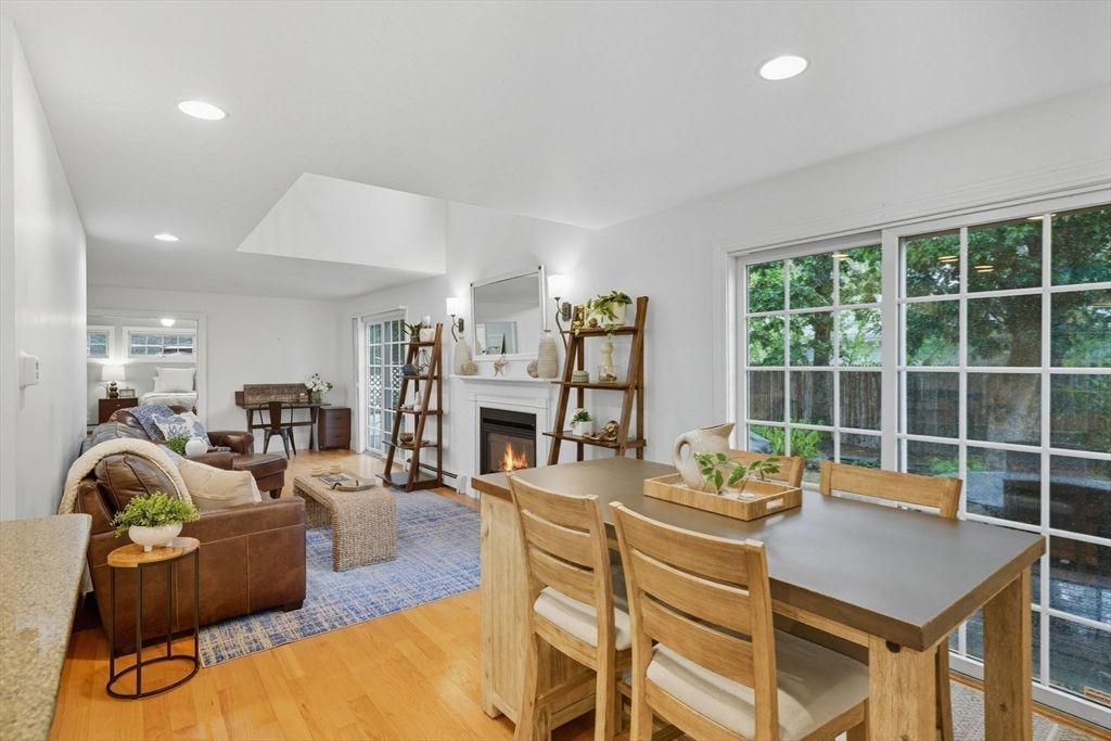 Dining room, Fireplace, Interior, Living room, Recessed Lighting, Wood Texture Flooring