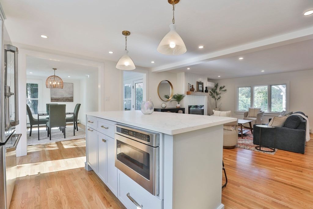 Dining room, Fireplace, Interior, Kitchen, Living room, Pendant Lights, Recessed Lighting, Stainless Steel Appliances, Wood Texture Flooring