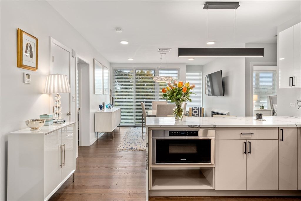 Dining room, Interior, Kitchen, Pendant Lights, Recessed Lighting, Stainless Steel Appliances, Wood Texture Flooring