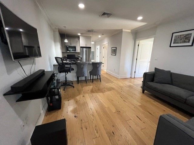 Dining room, Interior, Kitchen, Pendant Lights, Recessed Lighting, Stainless Steel Appliances, Wood Texture Flooring