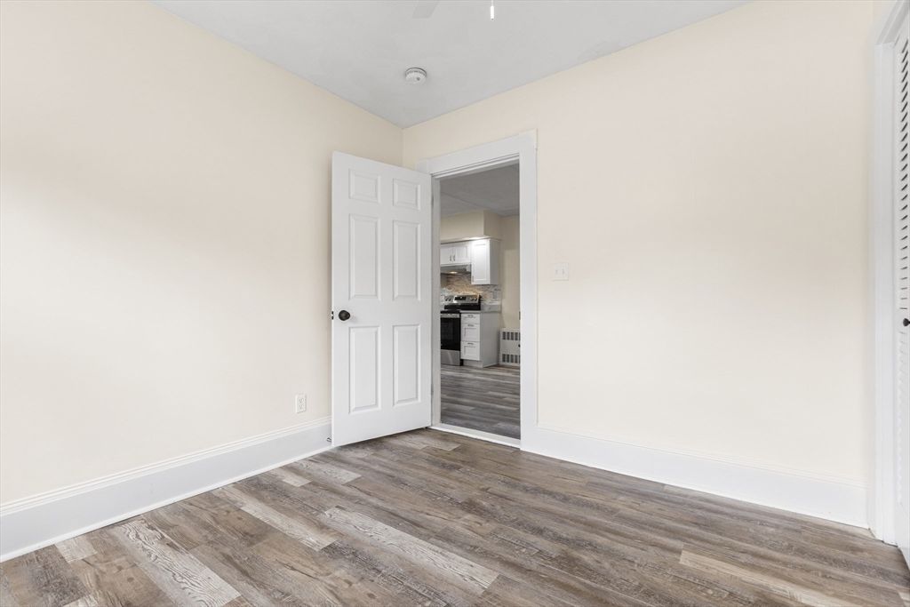 Empty room, Interior, Kitchen, Stainless Steel Appliances, Wood Texture Flooring