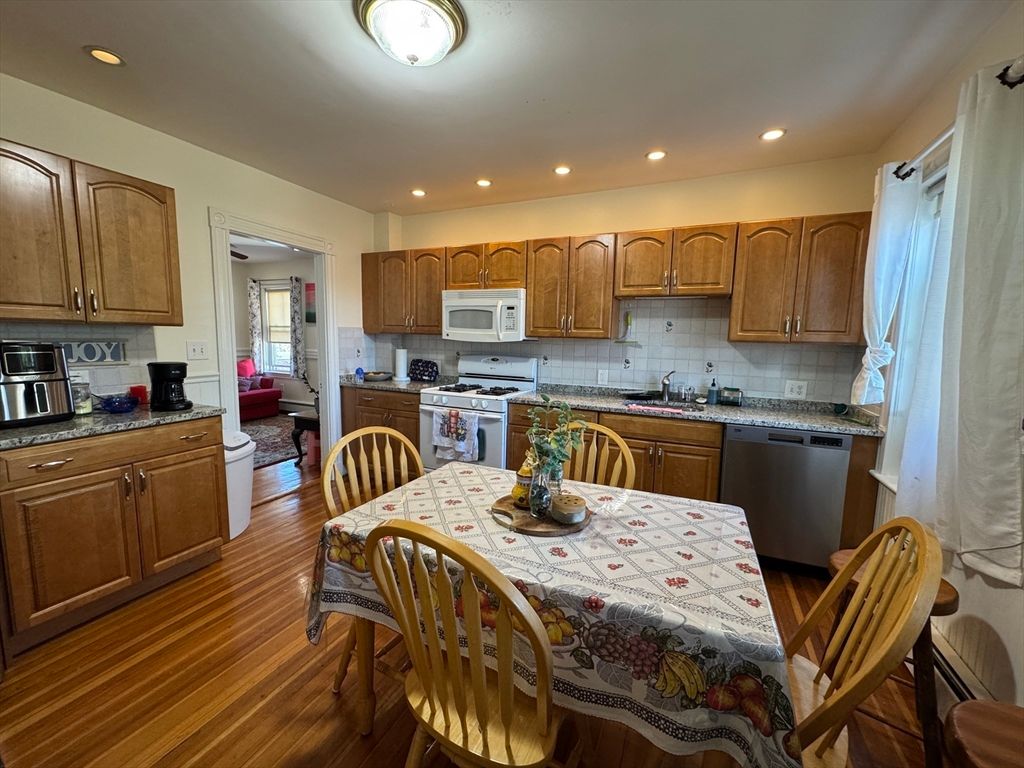 Dining room, Interior, Kitchen, Recessed Lighting, Stainless Steel Appliances, Wood Texture Flooring