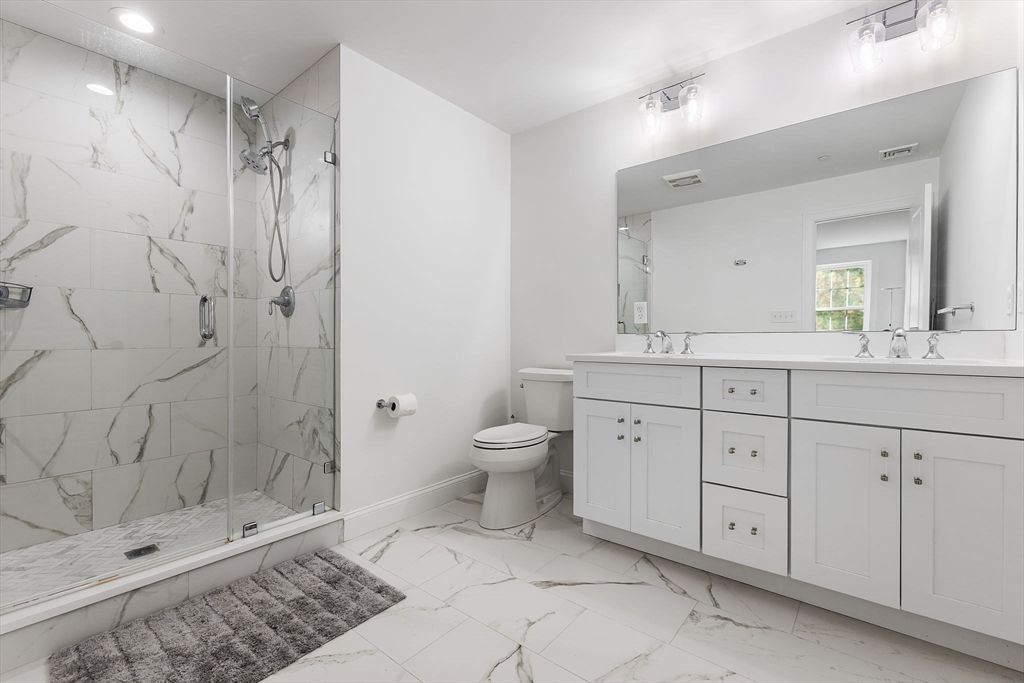 Bathroom, Dual Sink Vanities, Glass Shower, Interior, Marble, Marble Walls, Recessed Lighting
