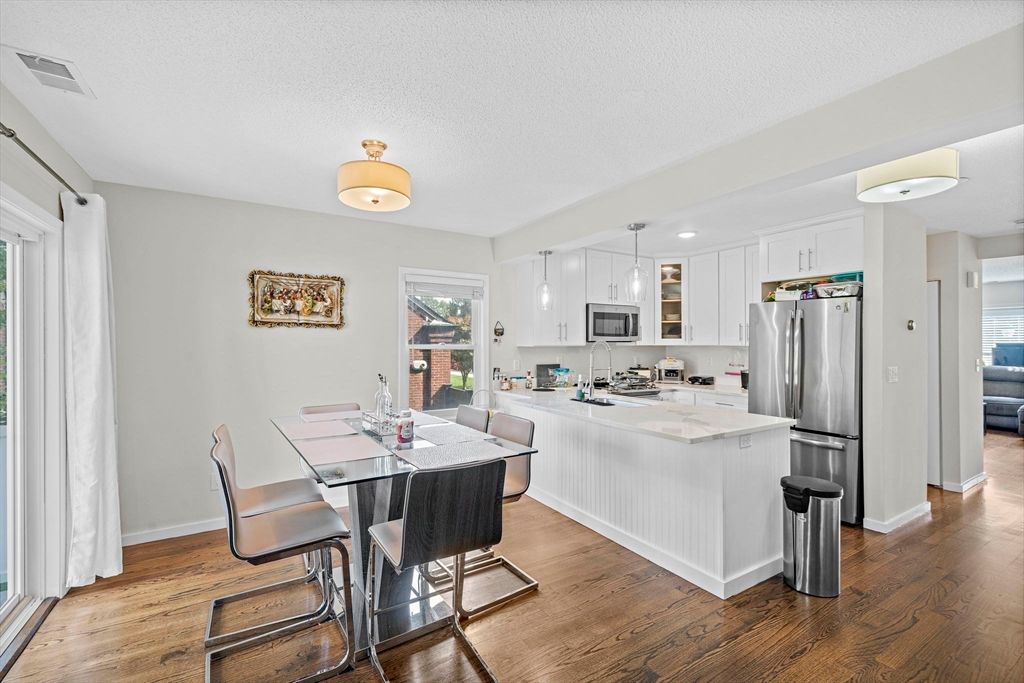 Dining room, Interior, Kitchen, Pendant Lights, Recessed Lighting, Stainless Steel Appliances, Wood Texture Flooring