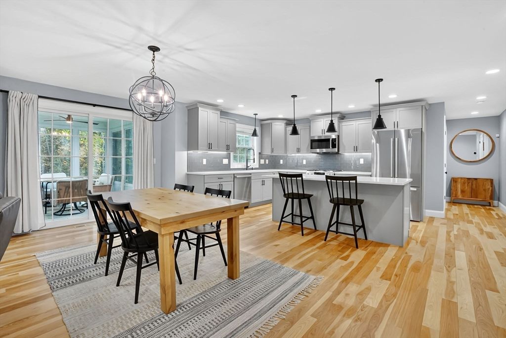 Chandelier, Dining room, Interior, Kitchen, Pendant Lights, Recessed Lighting, Stainless Steel Appliances, Wood Texture Flooring