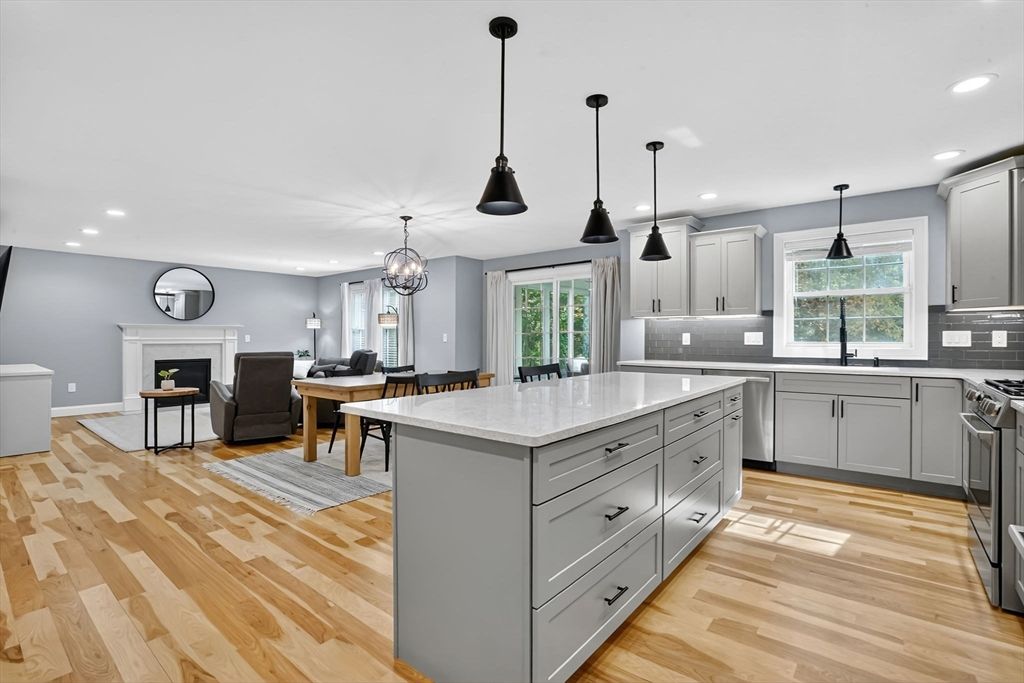 Chandelier, Dining room, Fireplace, Interior, Kitchen, Living room, Pendant Lights, Recessed Lighting, Wood Texture Flooring