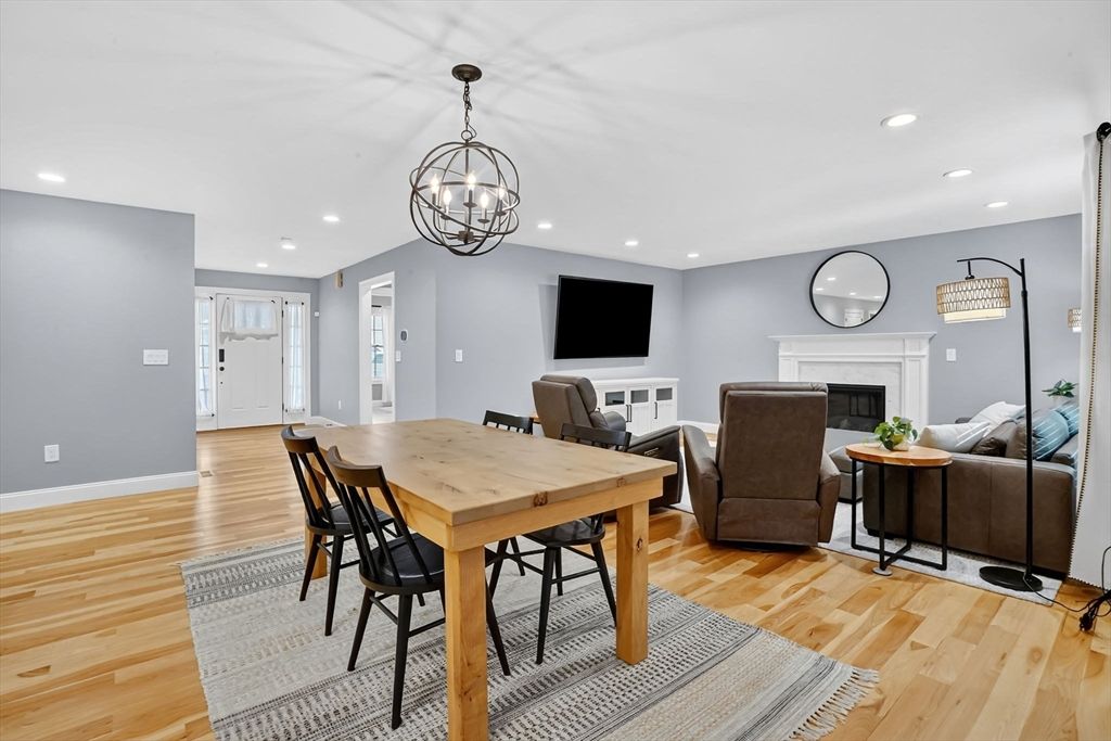 Chandelier, Dining room, Fireplace, Interior, Living room, Recessed Lighting, Wood Texture Flooring