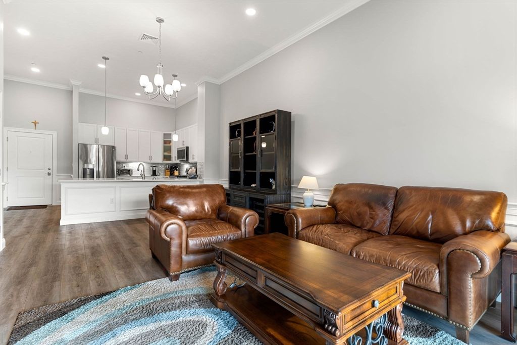 Chandelier, Interior, Kitchen, Living room, Pendant Lights, Recessed Lighting, Stainless Steel Appliances, Wood Texture Flooring