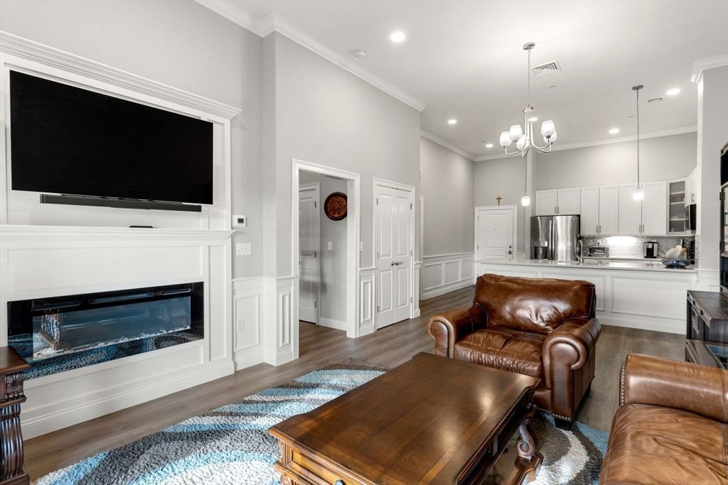 Fireplace, Interior, Kitchen, Living room, Pendant Lights, Recessed Lighting, Stainless Steel Appliances, Wood Texture Flooring
