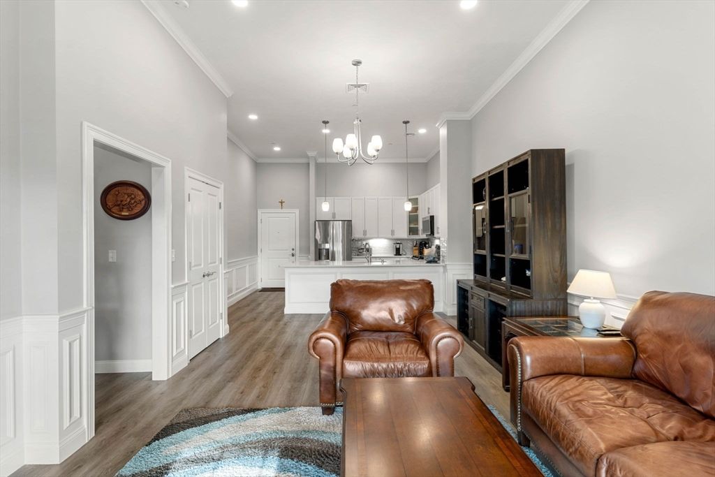Chandelier, Interior, Kitchen, Living room, Pendant Lights, Recessed Lighting, Stainless Steel Appliances, Wood Texture Flooring