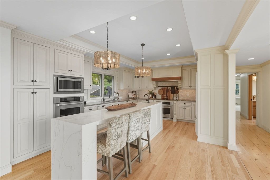 Chandelier, Interior, Kitchen, Pendant Lights, Recessed Lighting, Stainless Steel Appliances, Wood Texture Flooring