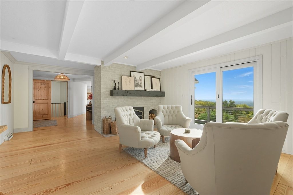 Fireplace, Interior, Living room, Recessed Lighting, Stone Walls, Wood Texture Flooring