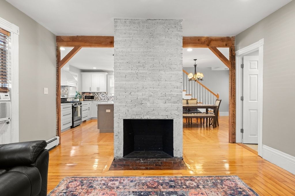 Chandelier, Dining room, Fireplace, Interior, Kitchen, Recessed Lighting, Stone Walls, Wooden Beams, Wood Texture Flooring