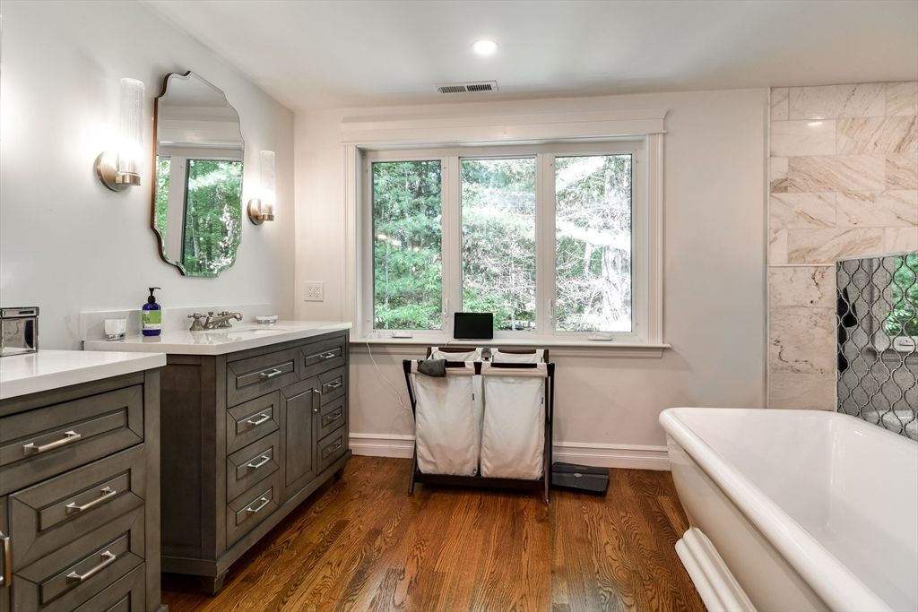 Bathroom, Free Standing Baths, Interior, Marble Walls, Recessed Lighting, Wood Texture Flooring