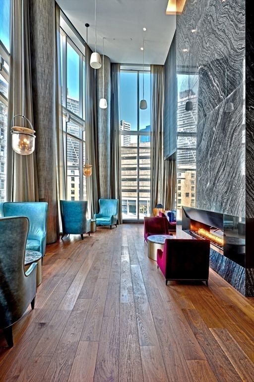 Fireplace, Interior, Living room, Marble Walls, Pendant Lights, Recessed Lighting, Wood Texture Flooring