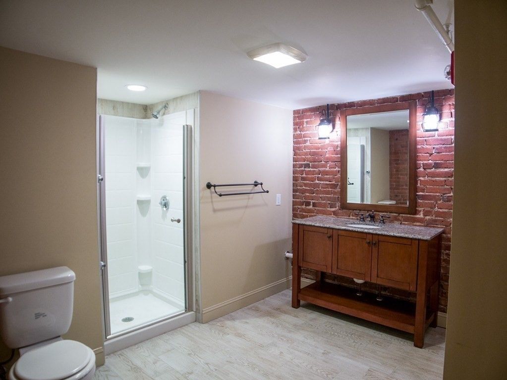 Bathroom, Glass Shower, Interior, Recessed Lighting, Stone Walls, Wood Texture Flooring