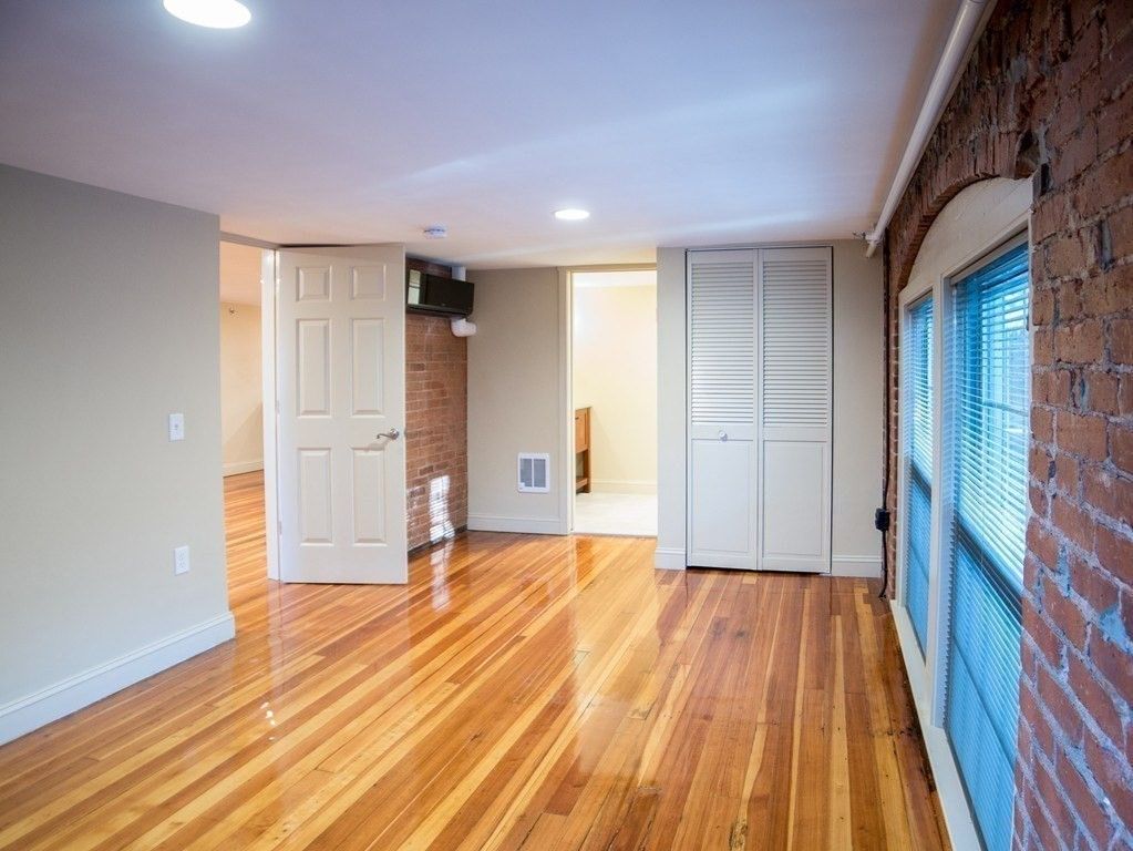 Empty room, Interior, Recessed Lighting, Stone Walls, Wood Texture Flooring