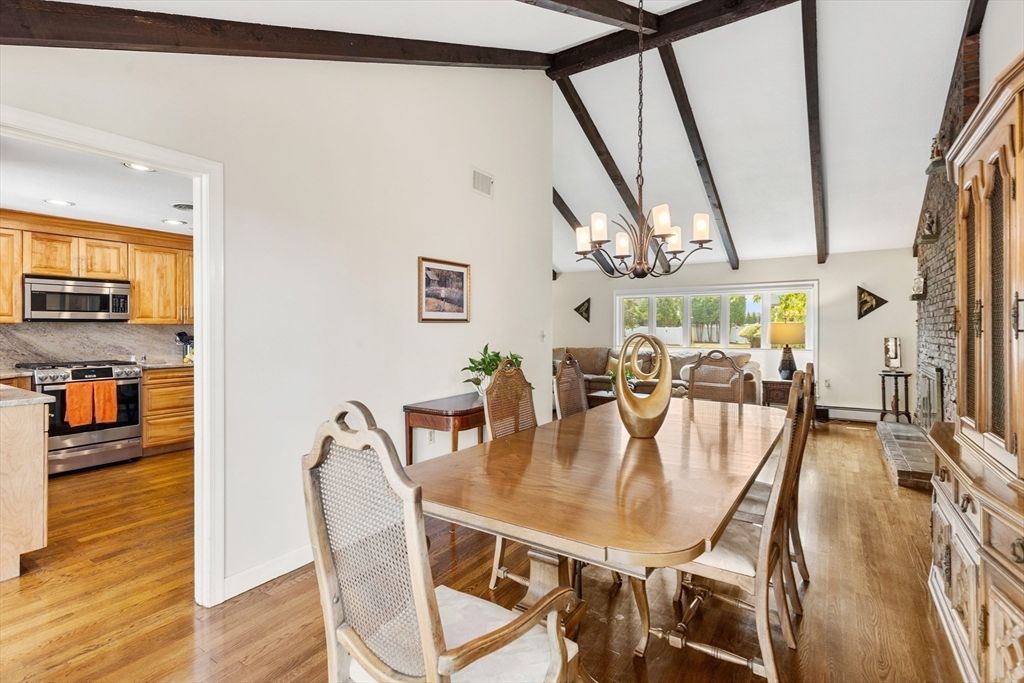 Chandelier, Dining room, Interior, Kitchen, Recessed Lighting, Stainless Steel Appliances, Wooden Beams, Wood Texture Flooring