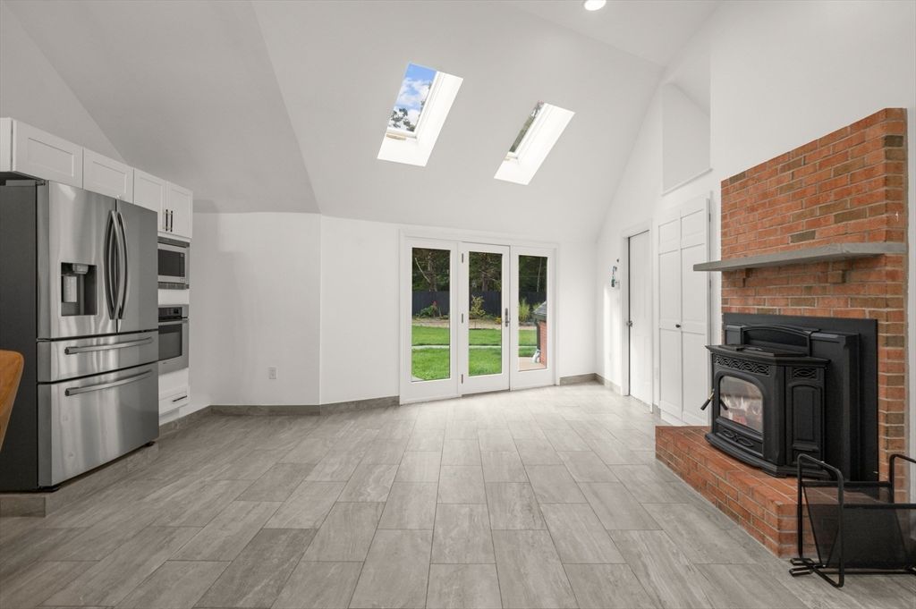 Fireplace, Interior, Kitchen, Recessed Lighting, Stone Walls, Wood Texture Flooring