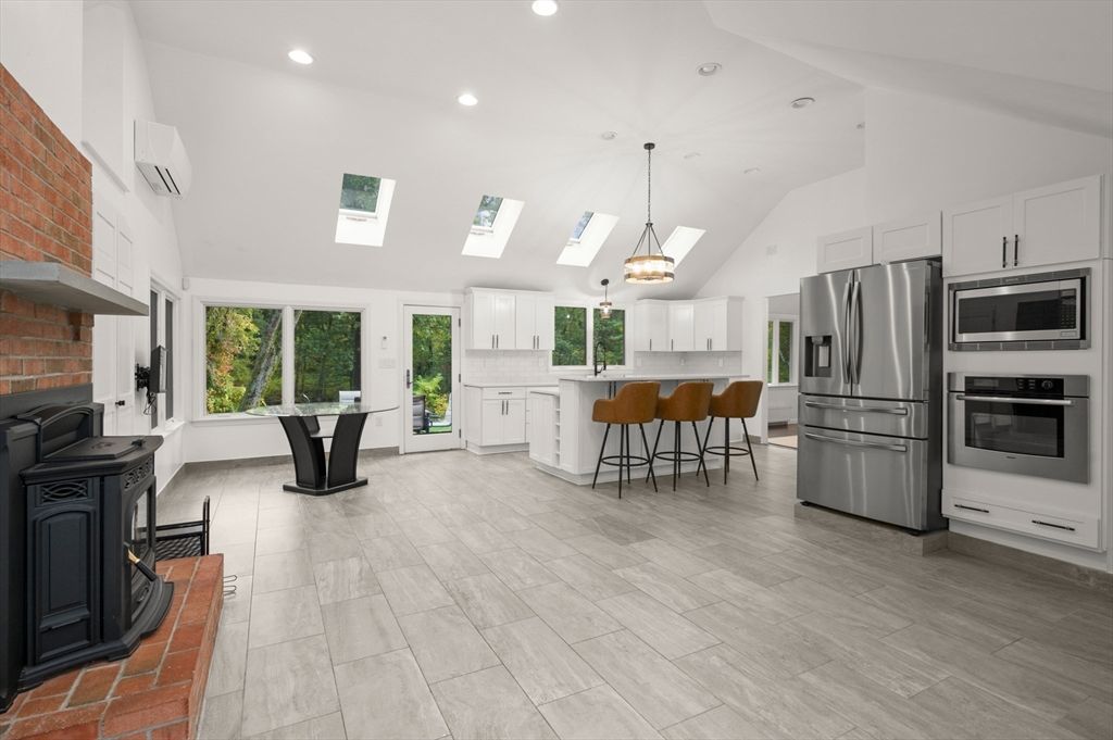 Fireplace, Interior, Kitchen, Pendant Lights, Recessed Lighting, Stainless Steel Appliances, Wood Texture Flooring