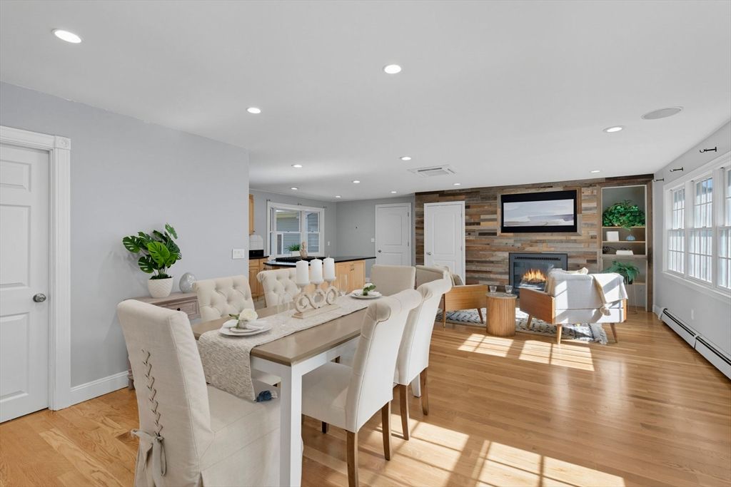 Dining room, Fireplace, Interior, Living room, Recessed Lighting, Stone Walls, Wood Texture Flooring, Wooden Walls
