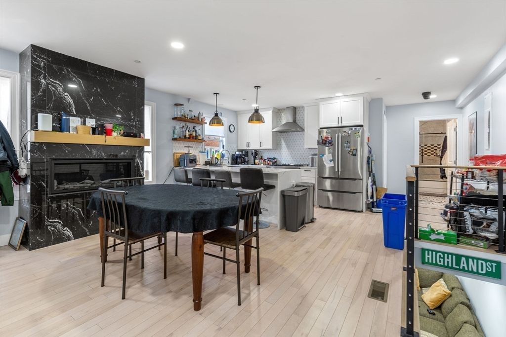 Dining room, Fireplace, Interior, Kitchen, Marble Walls, Pendant Lights, Recessed Lighting, Wood Texture Flooring