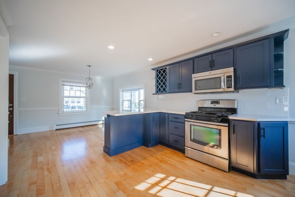 Interior, Kitchen, Pendant Lights, Recessed Lighting, Stainless Steel Appliances, Wood Texture Flooring