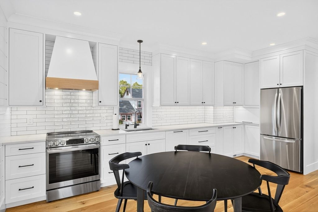 Dining room, Interior, Kitchen, Pendant Lights, Recessed Lighting, Stainless Steel Appliances, Wood Texture Flooring