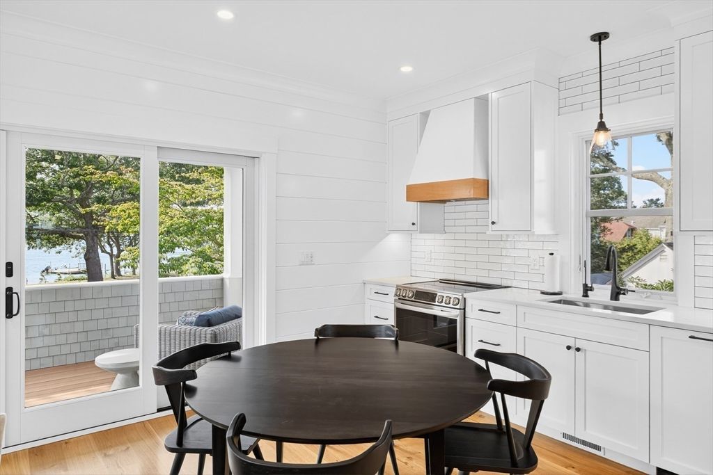 Dining room, Interior, Kitchen, Pendant Lights, Recessed Lighting, Stainless Steel Appliances, Water, Wood Texture Flooring