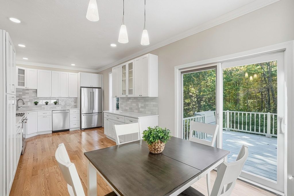 Dining room, Interior, Kitchen, Pendant Lights, Recessed Lighting, Stainless Steel Appliances, Wood Texture Flooring