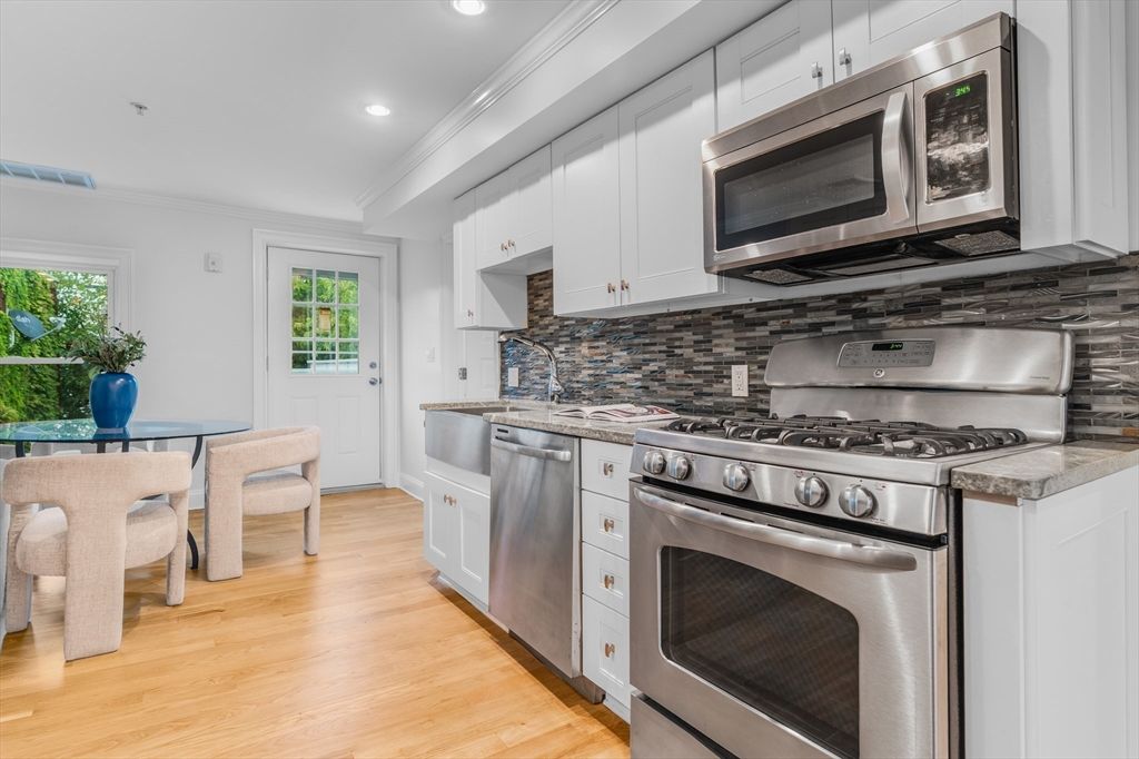 Dining room, Interior, Kitchen, Recessed Lighting, Stainless Steel Appliances, Wood Texture Flooring