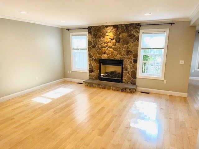 Empty room, Fireplace, Interior, Recessed Lighting, Stone Walls, Wood Texture Flooring