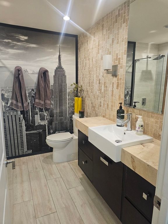 Bathroom, Dual Sink Vanities, Interior, Recessed Lighting, Wood Texture Flooring