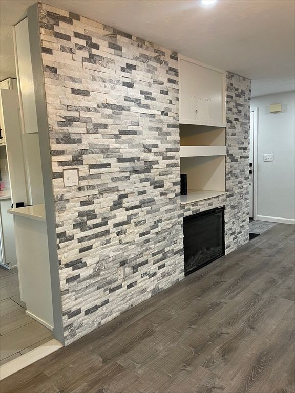 Fireplace, Interior, Recessed Lighting, Stone Walls, Wood Texture Flooring