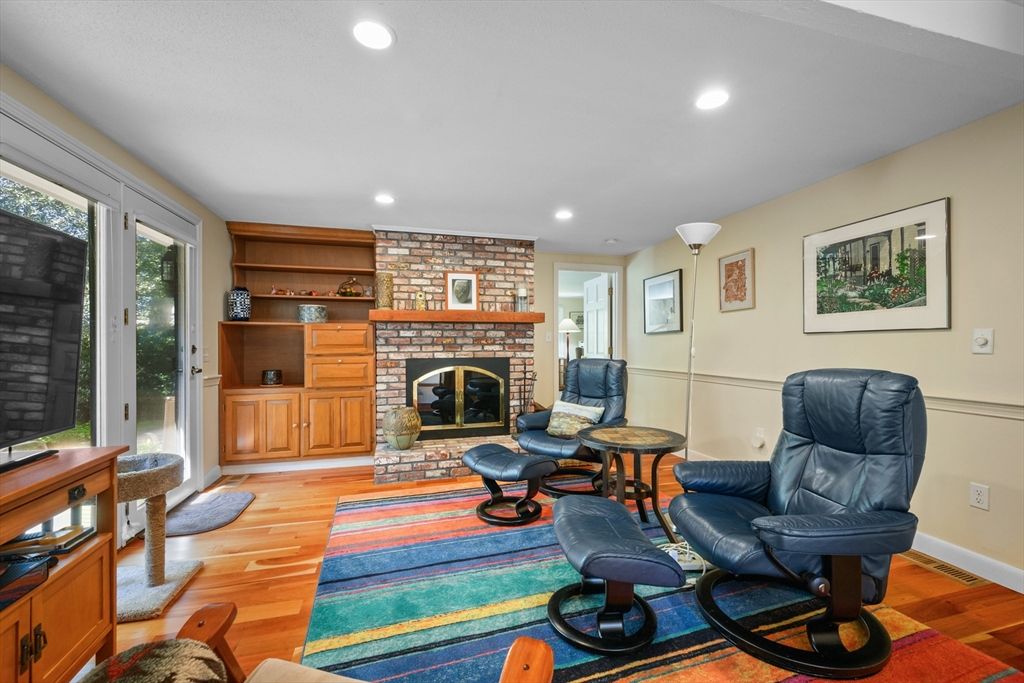 Fireplace, Interior, Living room, Recessed Lighting, Stone Walls, Wood Texture Flooring