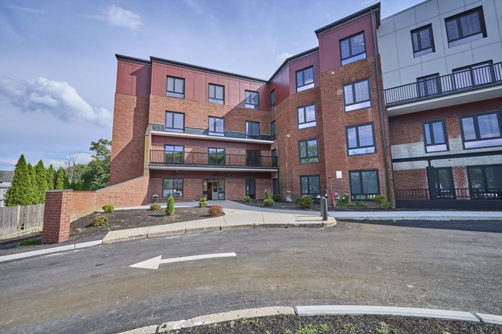 Exterior, Facade, Brick Facade, Condo Building