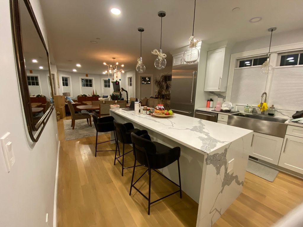 Dining room, Interior, Kitchen, Pendant Lights, Recessed Lighting, Stainless Steel Appliances, Wood Texture Flooring