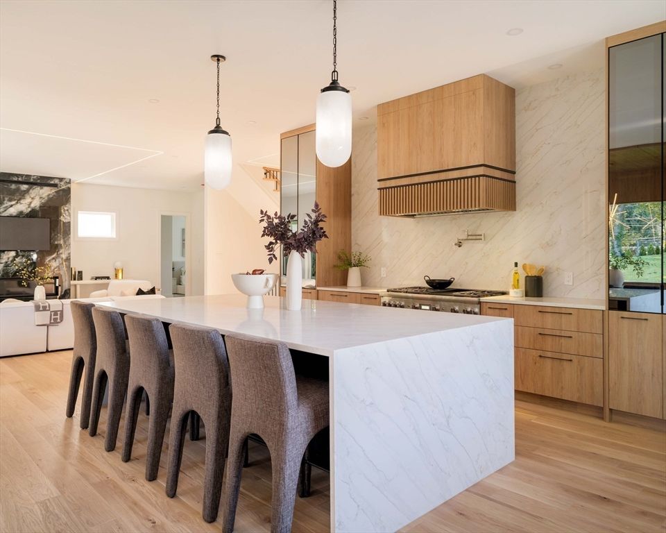 Interior, Kitchen, Living room, Marble Walls, Pendant Lights, Recessed Lighting, Stainless Steel Appliances, Wood Texture Flooring